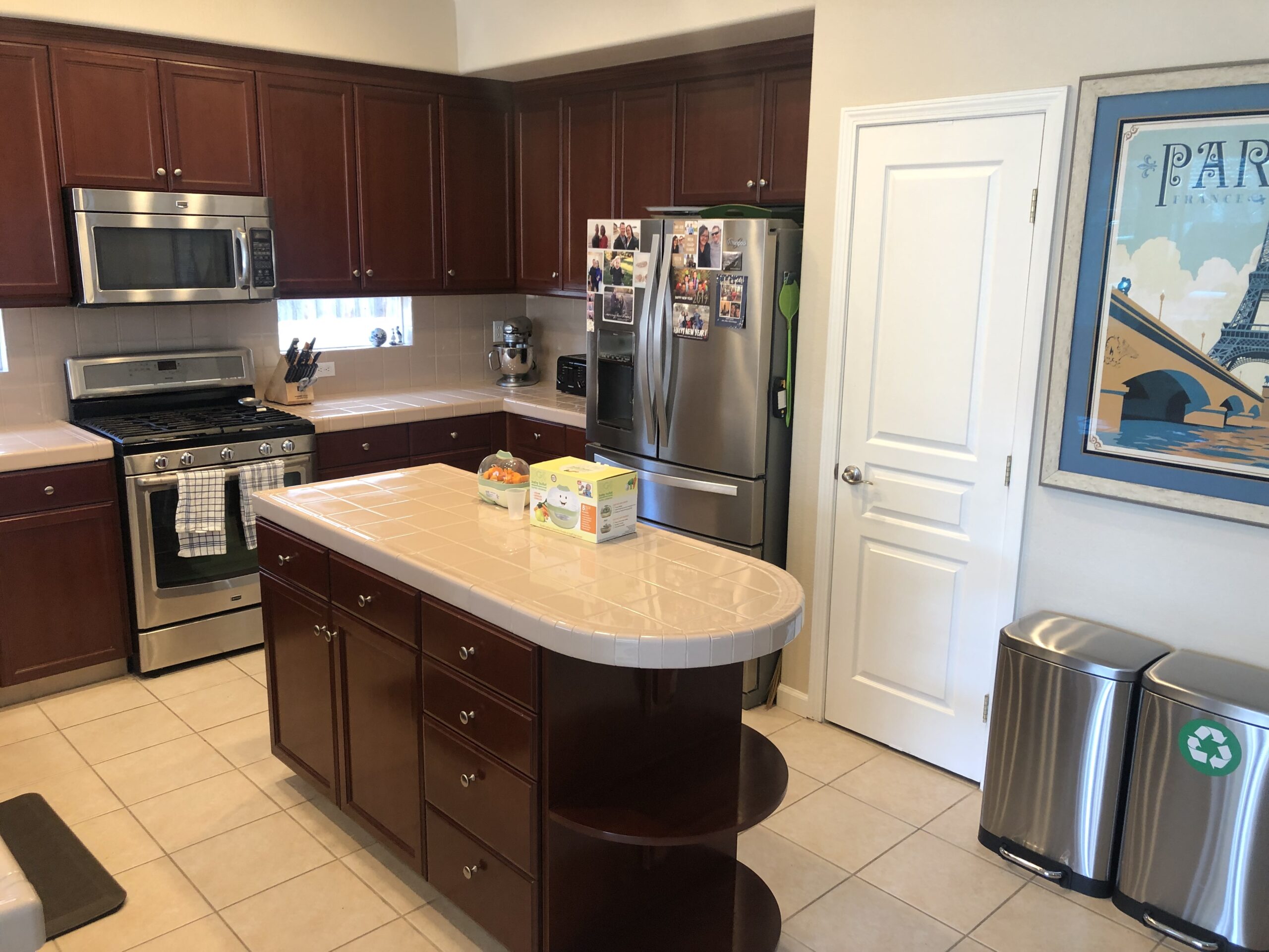 Cabinets and island before a kitchen refresh