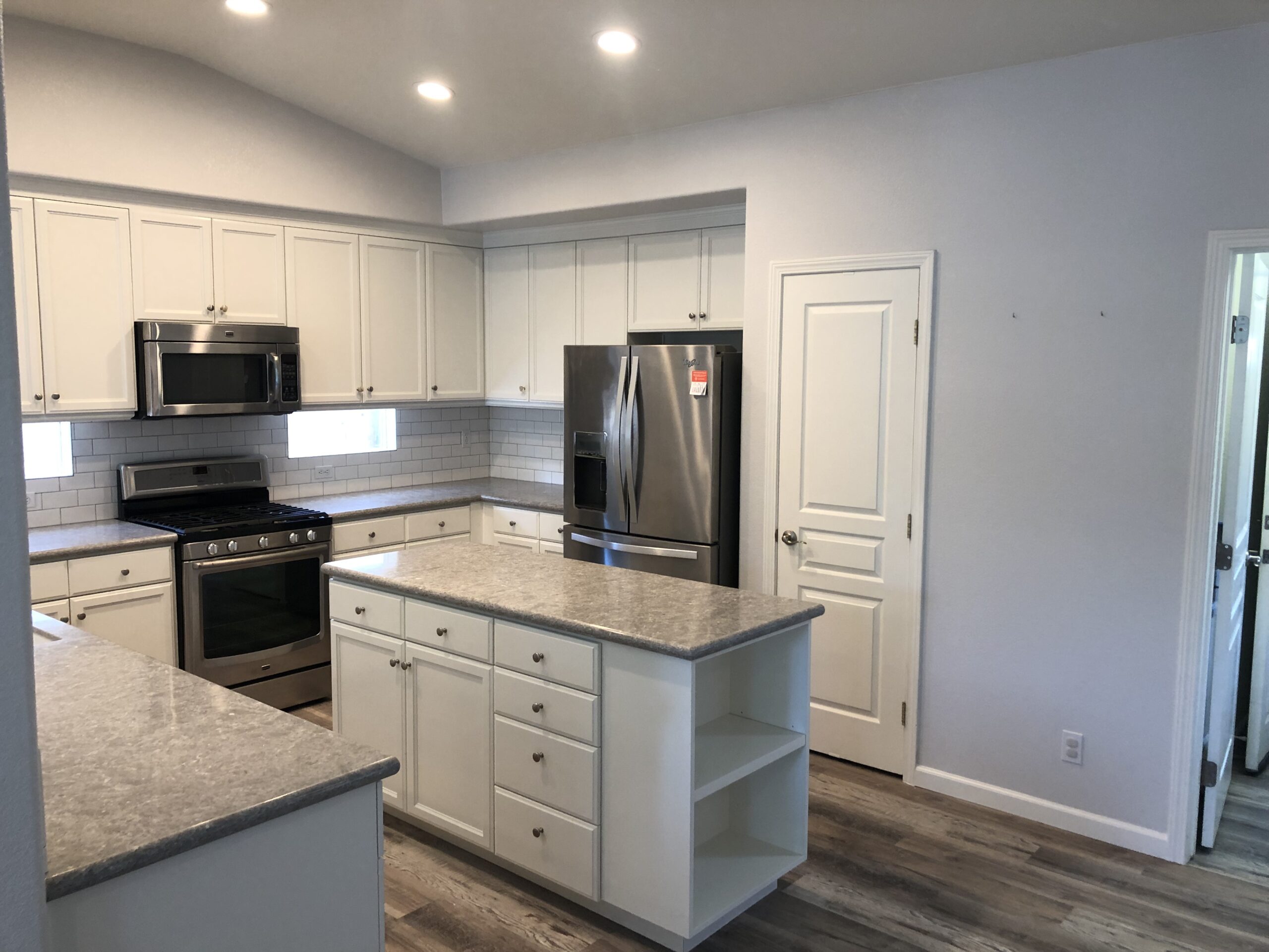 Updated cabinet finish and island in kitchen refresh